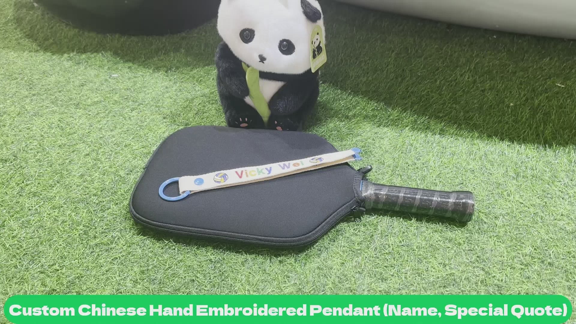Video showcasing rackets with customizable Chinese hand-embroidered pendants and personalized name printing.